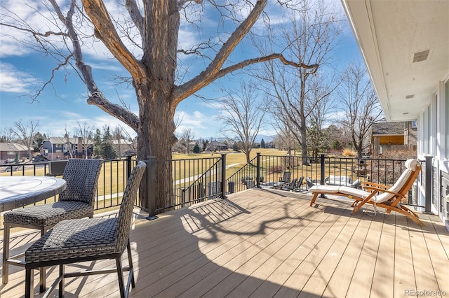 wooden deck featuring visible vents