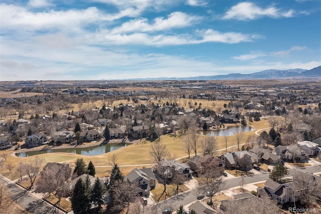 aerial view with a residential view and a water and mountain view