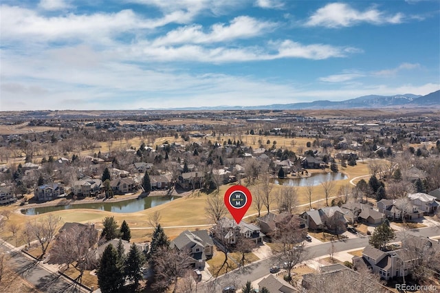 bird's eye view featuring a residential view and a water and mountain view