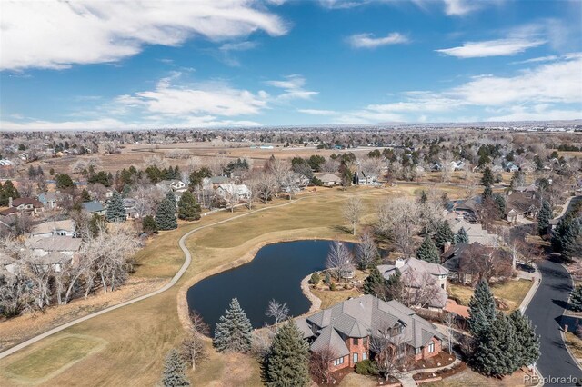 birds eye view of property featuring a water view and a residential view