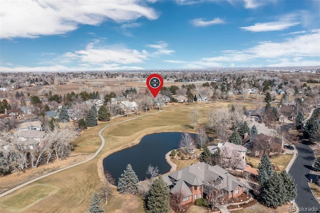 drone / aerial view with a residential view and a water view