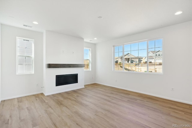 unfurnished living room featuring light hardwood / wood-style flooring