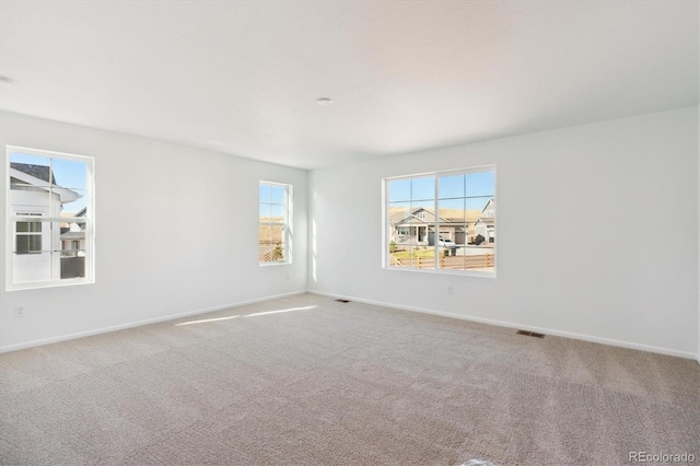 empty room with carpet flooring