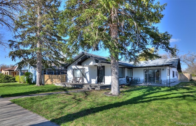 693 E Ave, Limon, CO 80828 - single story home with central air condition unit and a front lawn