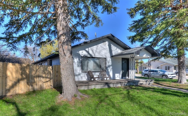 693 E Ave, Limon, CO 80828 - back of house featuring fence, a yard, and a porch