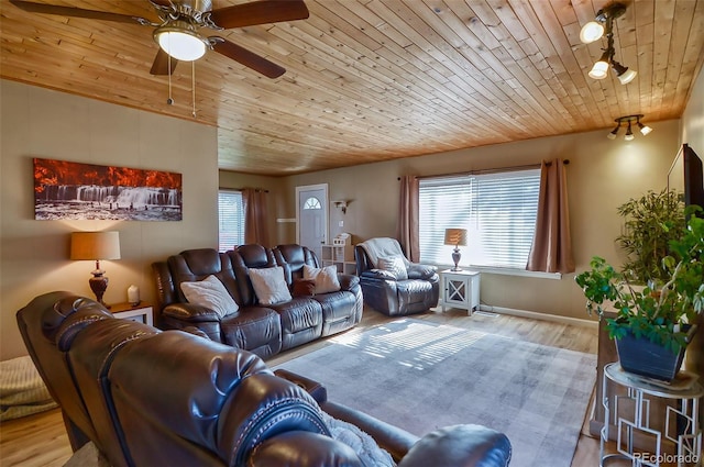 693 E Ave, Limon, CO 80828 - living area featuring wooden ceiling, baseboards, a ceiling fan, and wood finished floors