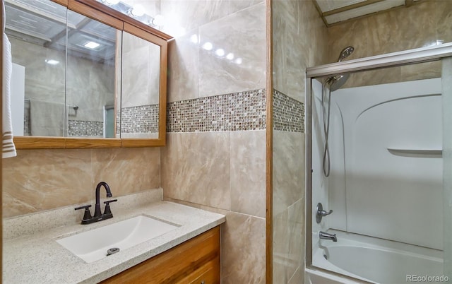 693 E Ave, Limon, CO 80828 - bathroom with vanity, shower / bathing tub combination, and tile walls
