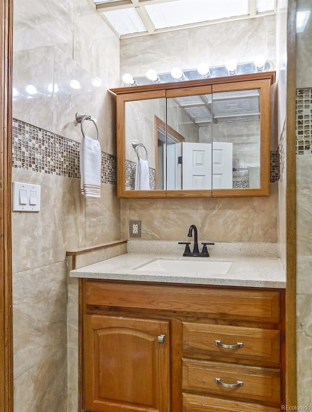 693 E Ave, Limon, CO 80828 - bathroom featuring vanity and tile walls