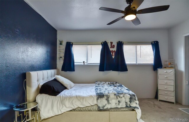 693 E Ave, Limon, CO 80828 - bedroom featuring ceiling fan and carpet