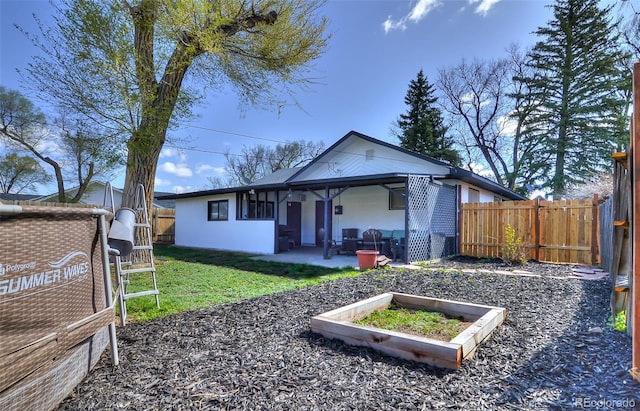 693 E Ave, Limon, CO 80828 - back of house featuring a yard, a fenced backyard, and a patio area