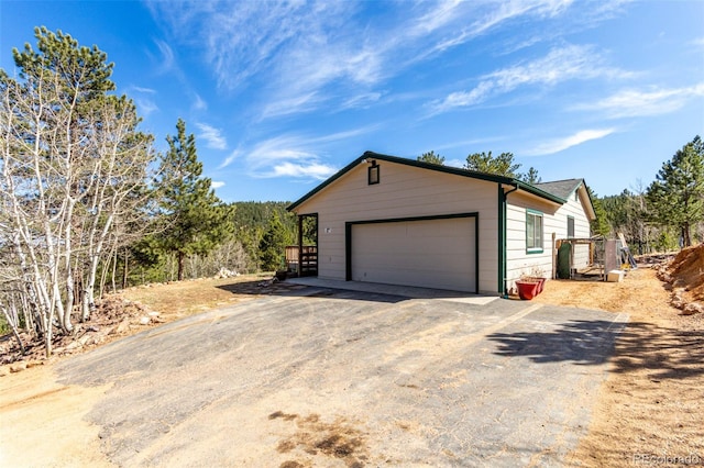 116 Schooley Rd, Bailey, CO 80421 - view of front of property featuring a garage and driveway