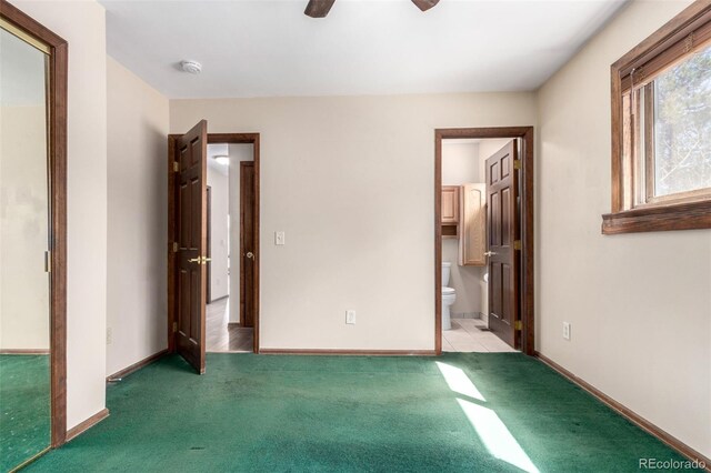 116 Schooley Rd, Bailey, CO 80421 - unfurnished bedroom featuring carpet flooring, connected bathroom, and a ceiling fan