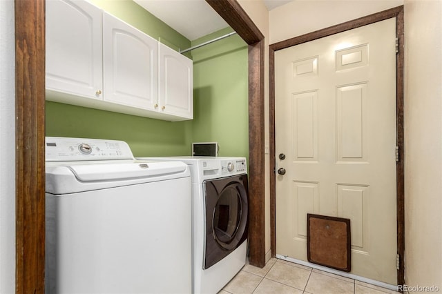 116 Schooley Rd, Bailey, CO 80421 - washroom featuring washing machine and clothes dryer, cabinet space, and light tile patterned flooring