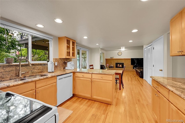 7439 S Depew St, Littleton, CO 80128 - kitchen featuring stainless steel dishwasher, a sink, range with electric stovetop, light wood-style floors, and recessed lighting