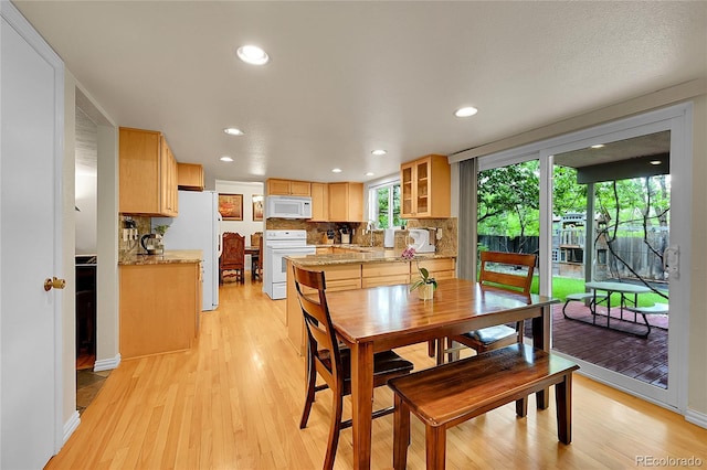 7439 S Depew St, Littleton, CO 80128 - dining room featuring light wood finished floors and recessed lighting