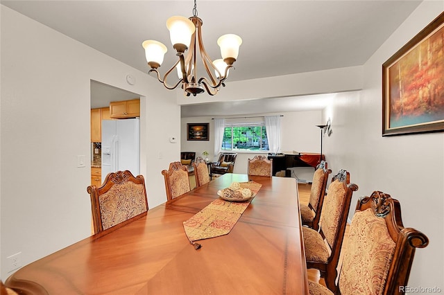 7439 S Depew St, Littleton, CO 80128 - dining space with a chandelier