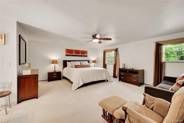 7439 S Depew St, Littleton, CO 80128 - bedroom with multiple windows, light colored carpet, and ceiling fan