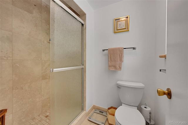 7439 S Depew St, Littleton, CO 80128 - full bathroom with a stall shower, toilet, and baseboards