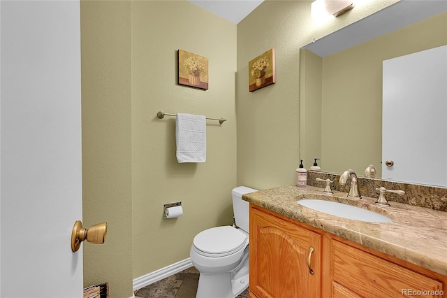 7439 S Depew St, Littleton, CO 80128 - half bath featuring vanity, toilet, and baseboards