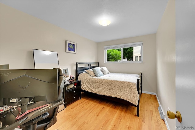 7439 S Depew St, Littleton, CO 80128 - bedroom featuring light wood-type flooring and baseboards