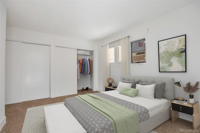 carpeted bedroom featuring cooling unit and multiple closets