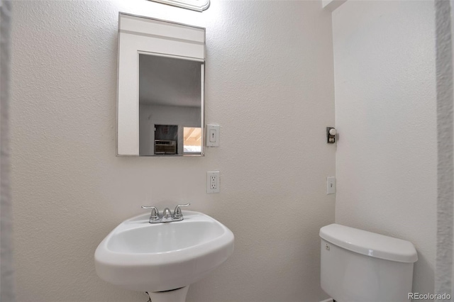 bathroom with sink and toilet