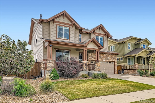 350 N Langdale Ct, Aurora, CO 80018 - craftsman inspired home with covered porch, driveway, stone siding, and a garage