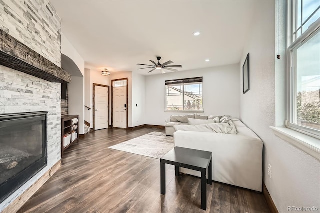 350 N Langdale Ct, Aurora, CO 80018 - living area with a stone fireplace, baseboards, a ceiling fan, dark wood finished floors, and recessed lighting