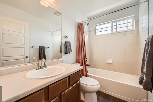 350 N Langdale Ct, Aurora, CO 80018 - bathroom with toilet, vanity, shower / bath combo with shower curtain, and wood finished floors