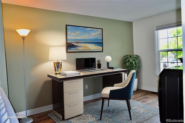 9713 W Chatfield Ave Unit H, Littleton, CO 80128 - office area featuring dark wood-style flooring and baseboards