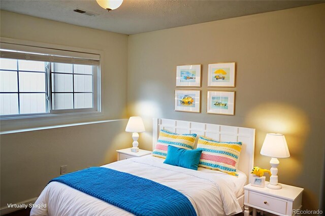 9713 W Chatfield Ave Unit H, Littleton, CO 80128 - bedroom with a textured ceiling