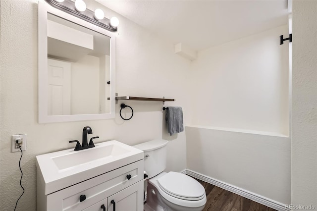 9713 W Chatfield Ave Unit H, Littleton, CO 80128 - bathroom with wood finished floors and vanity