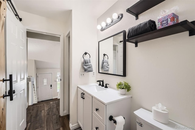 9713 W Chatfield Ave Unit H, Littleton, CO 80128 - bathroom featuring wood finished floors and vanity