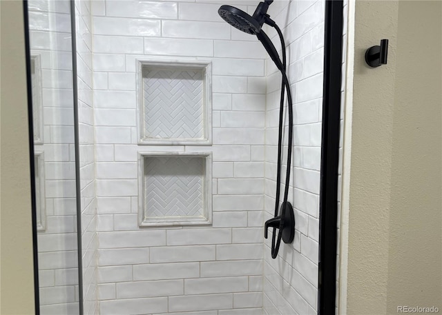 9713 W Chatfield Ave Unit H, Littleton, CO 80128 - bathroom view of a tile shower and a textured wall
