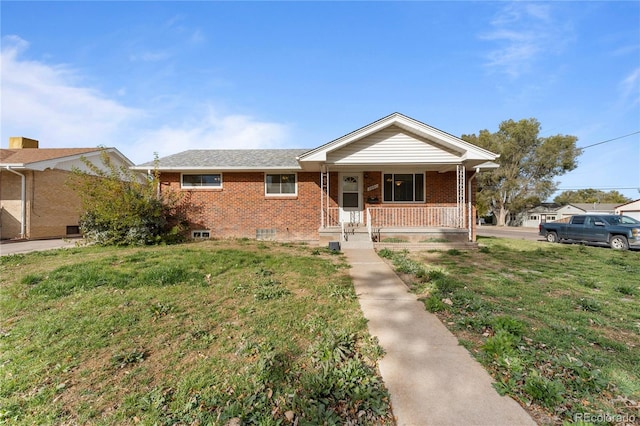 single story home featuring a porch and a front lawn