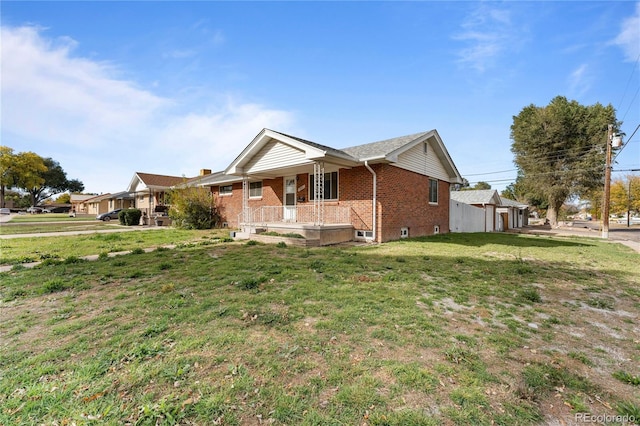 view of front of property with a front lawn and a porch