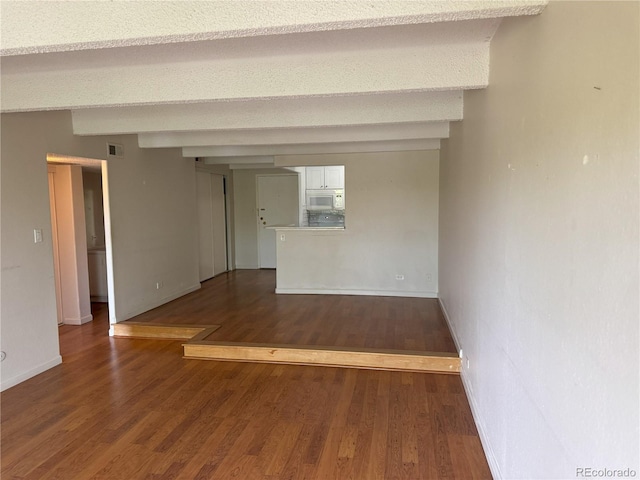 8060 E Girard Ave Unit 504, Denver, CO 80231 - empty room with wood finished floors and baseboards