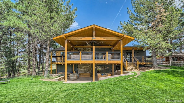 2231 Meadow Green Cir, Franktown, CO 80116 - back of property featuring a deck, a patio area, ceiling fan, and stone siding
