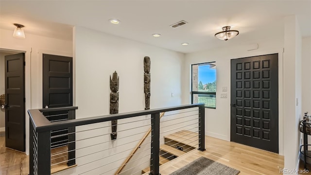 2231 Meadow Green Cir, Franktown, CO 80116 - entryway featuring light wood-type flooring and recessed lighting