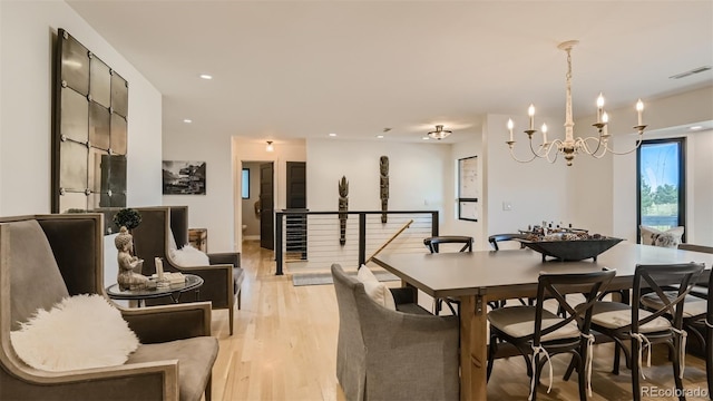 2231 Meadow Green Cir, Franktown, CO 80116 - dining space with light wood-style floors, a chandelier, and recessed lighting