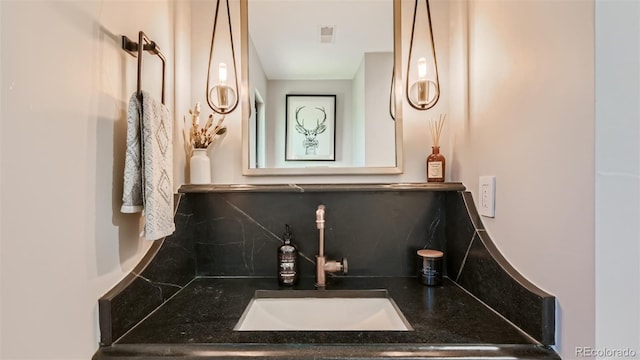 2231 Meadow Green Cir, Franktown, CO 80116 - bathroom featuring backsplash and vanity