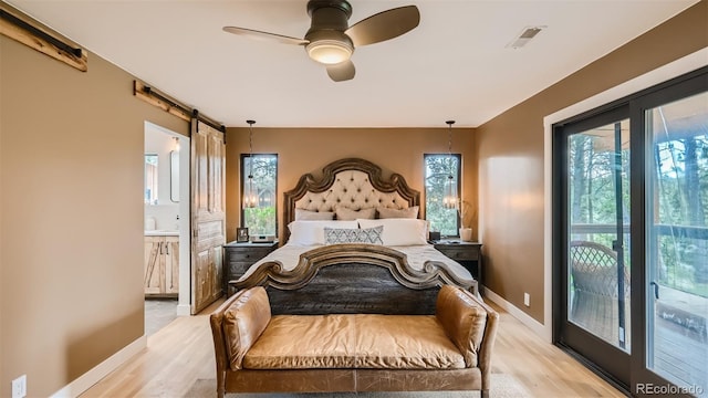 2231 Meadow Green Cir, Franktown, CO 80116 - bedroom featuring light wood finished floors and ensuite bath