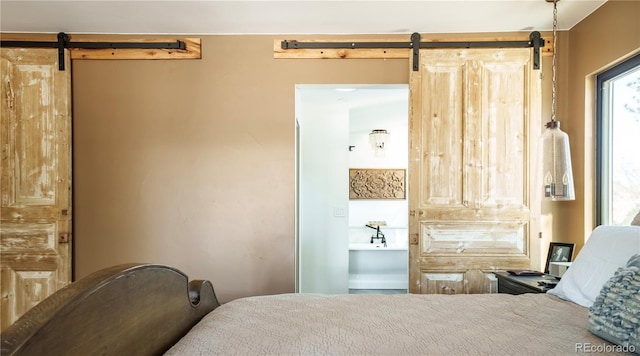 2231 Meadow Green Cir, Franktown, CO 80116 - bedroom with a barn door