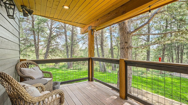 2231 Meadow Green Cir, Franktown, CO 80116 - wooden terrace with a yard and view of wooded area