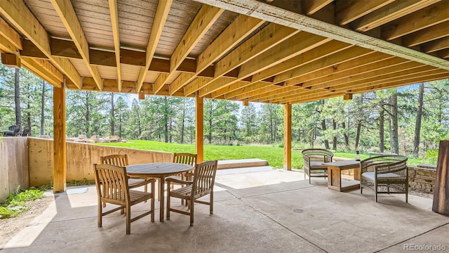 2231 Meadow Green Cir, Franktown, CO 80116 - view of patio / terrace featuring outdoor dining space and view of scattered trees