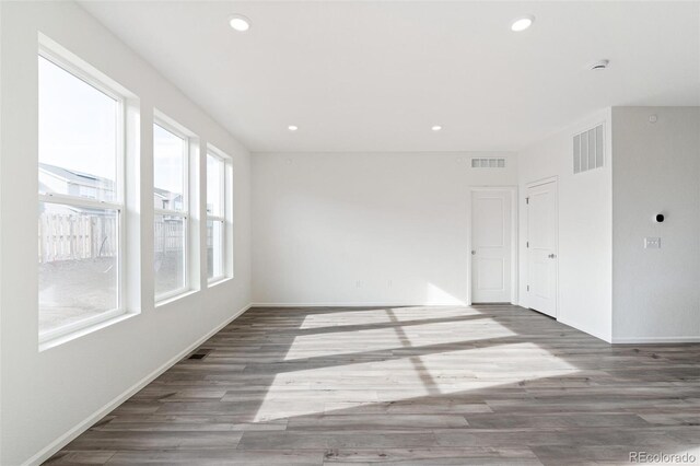 13412 E 110th Way, Commerce City, CO 80022 - empty room featuring wood finished floors, recessed lighting, and a smoke detector