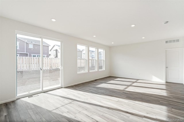 13412 E 110th Way, Commerce City, CO 80022 - spare room with wood finished floors and recessed lighting