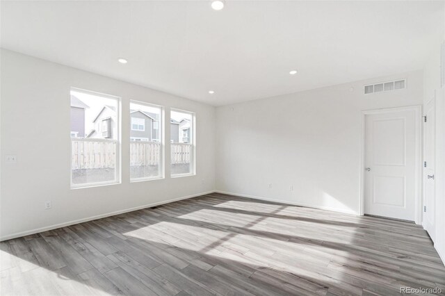 13412 E 110th Way, Commerce City, CO 80022 - empty room with wood finished floors and recessed lighting