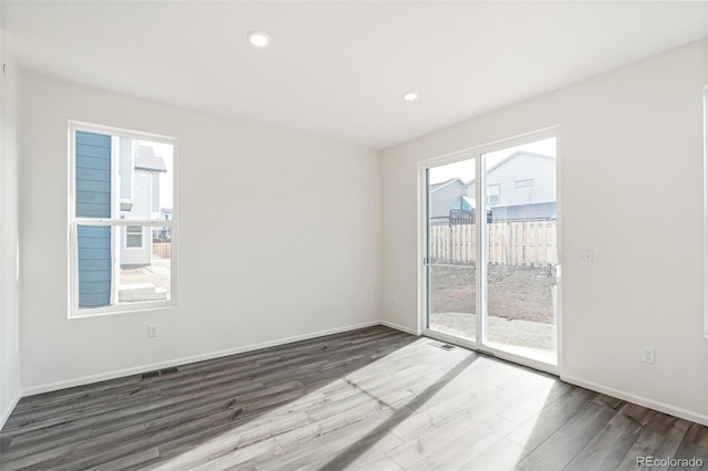 13412 E 110th Way, Commerce City, CO 80022 - spare room with wood finished floors and recessed lighting