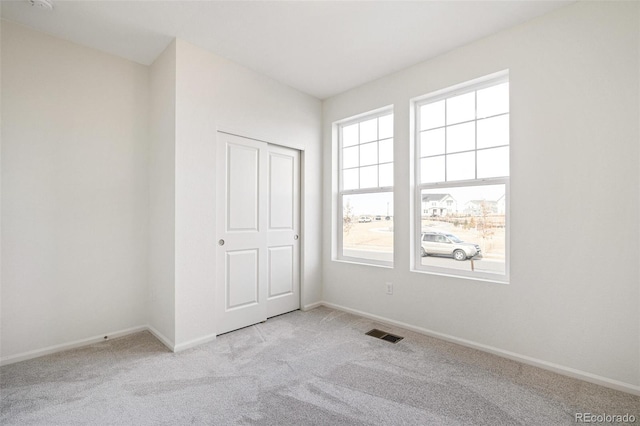 13412 E 110th Way, Commerce City, CO 80022 - unfurnished bedroom with multiple windows and light colored carpet
